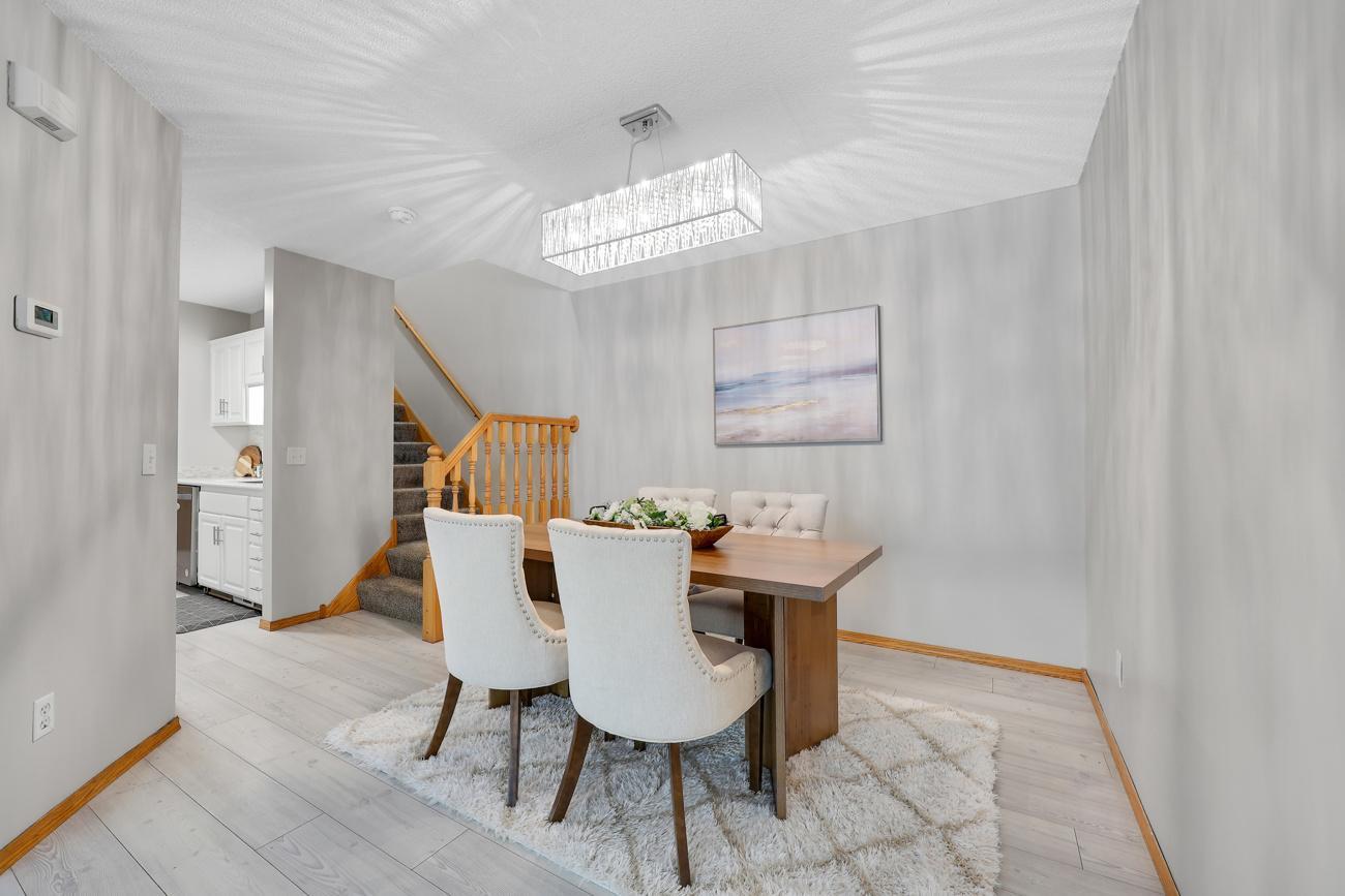 Dining room opens to living room and is located off the kitchen.