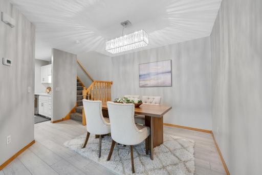 Dining room opens to living room and is located off the kitchen.