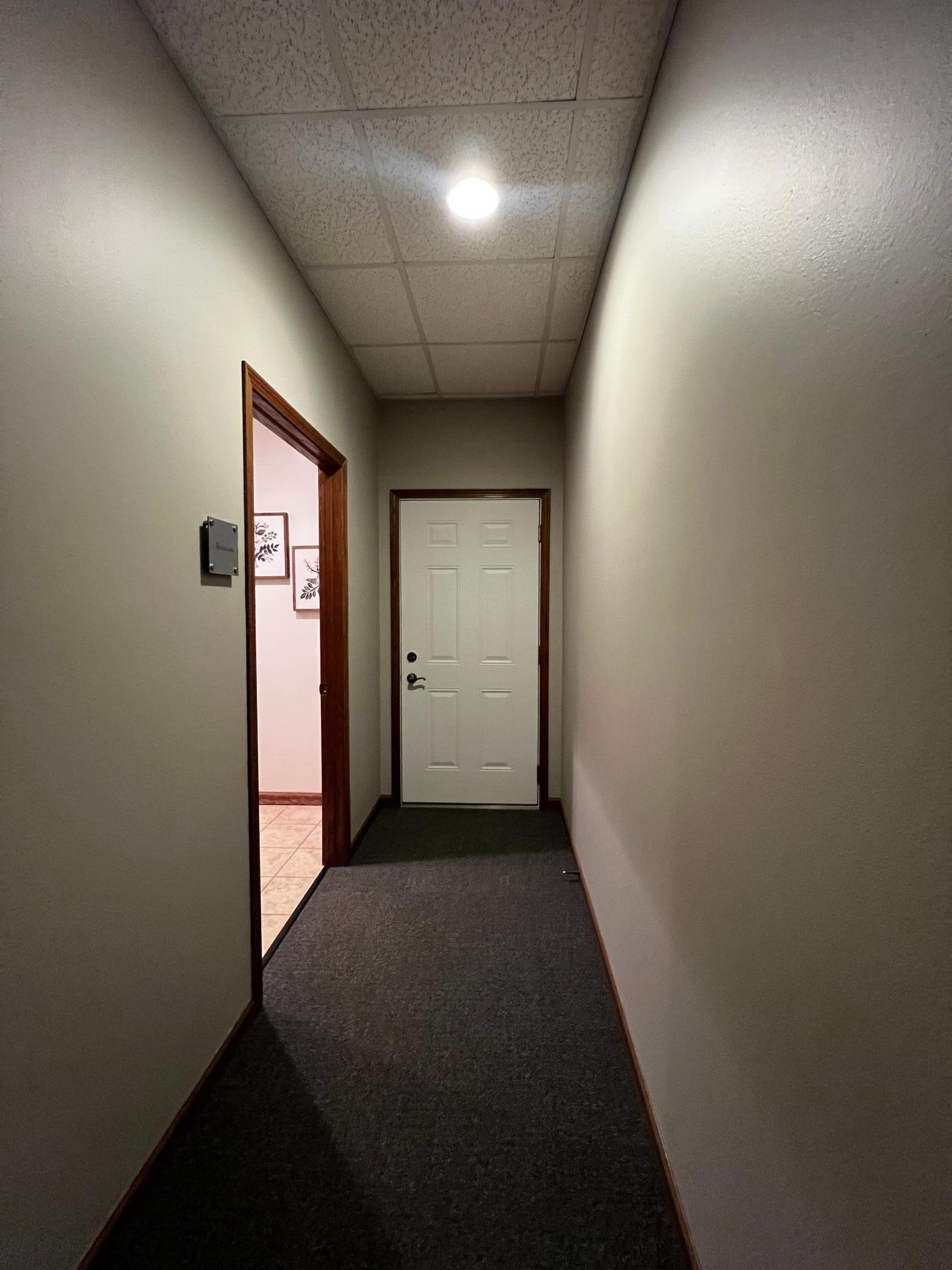 Hallway to Restroom and Back Door for Emergency Exit if needed.