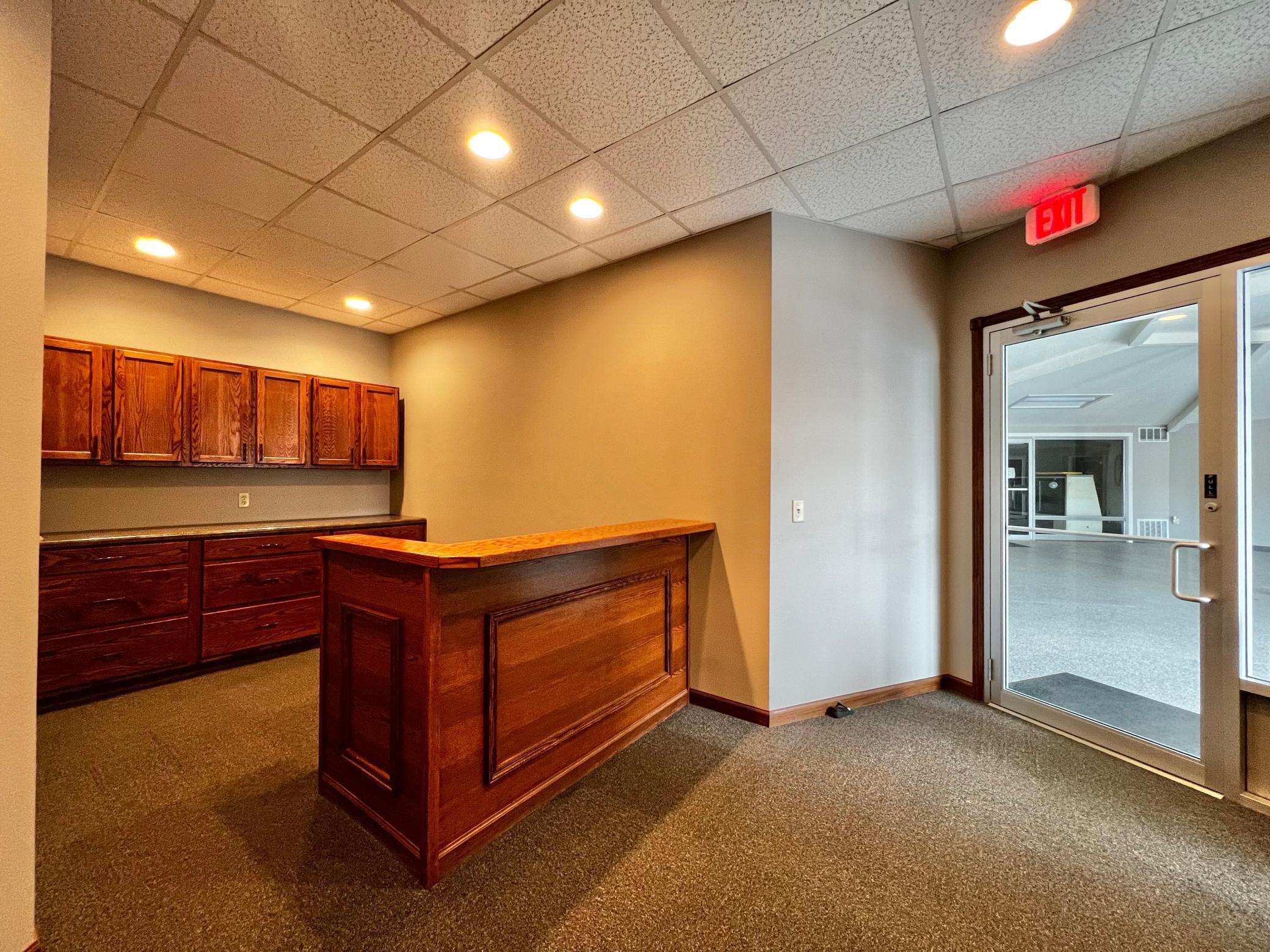 Reception Desk, several cabinets for storage.