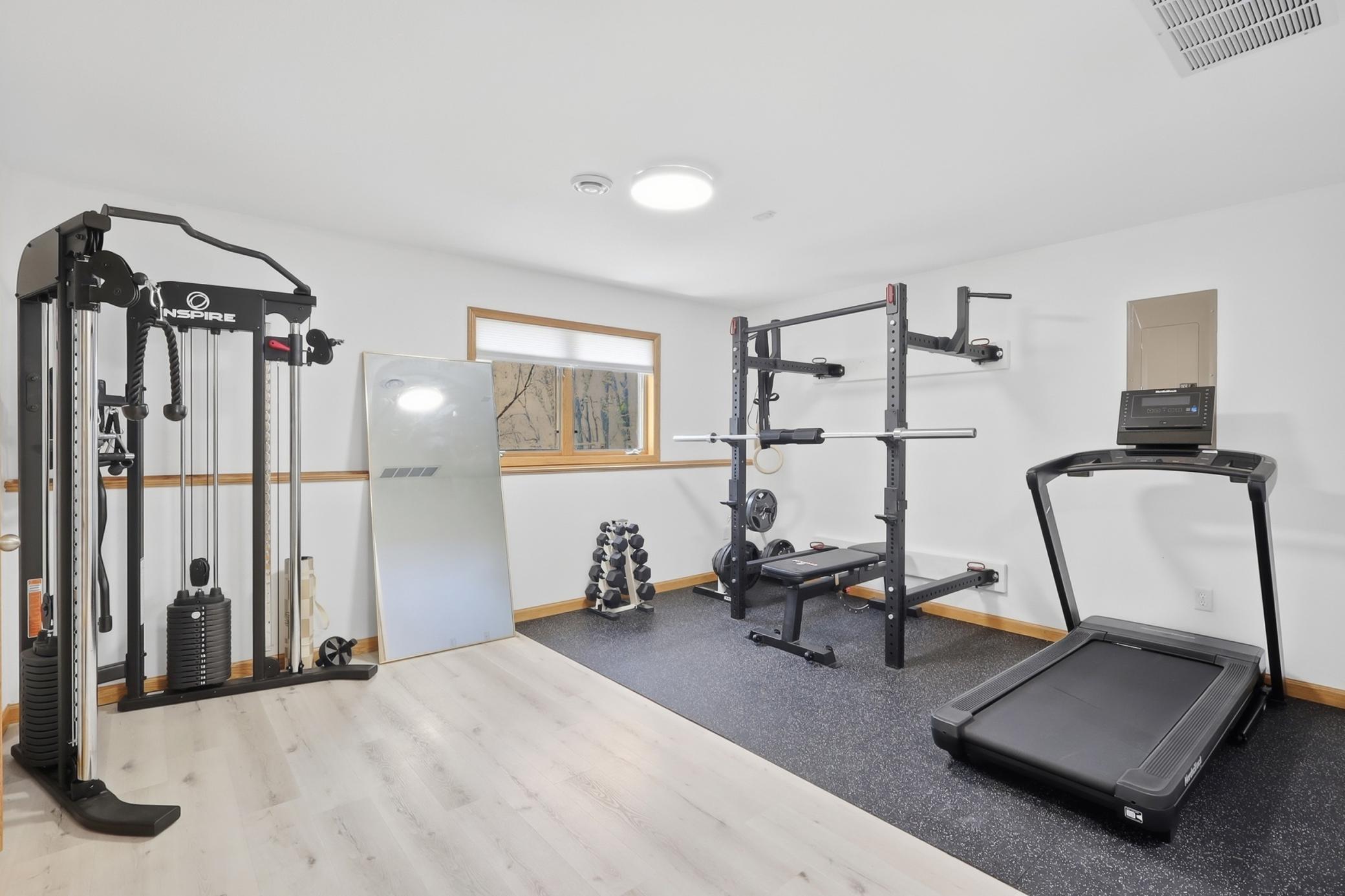 Lower level bedroom #4 being used as a gym