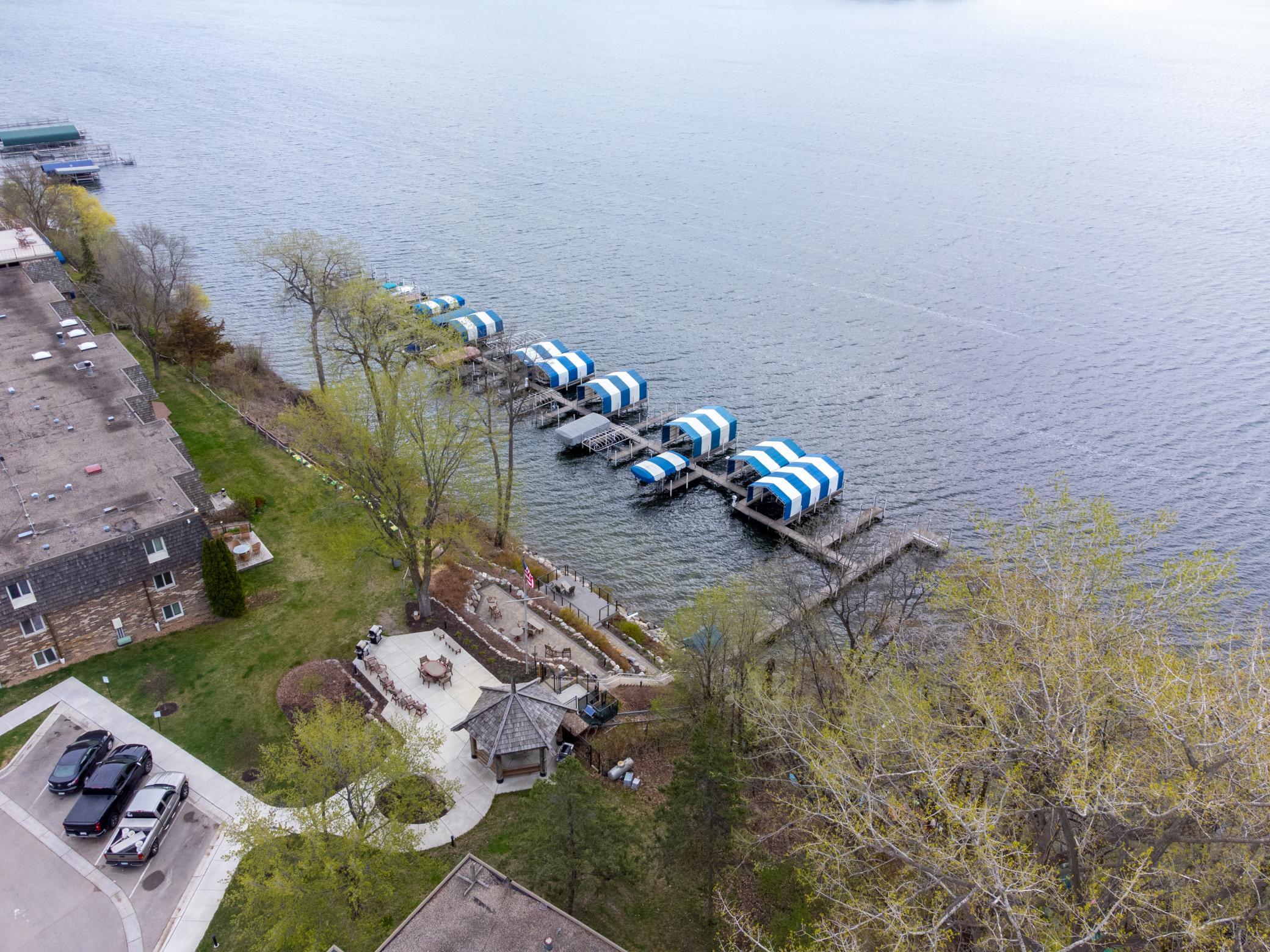 Lakeside patios, dock, swimming beach.