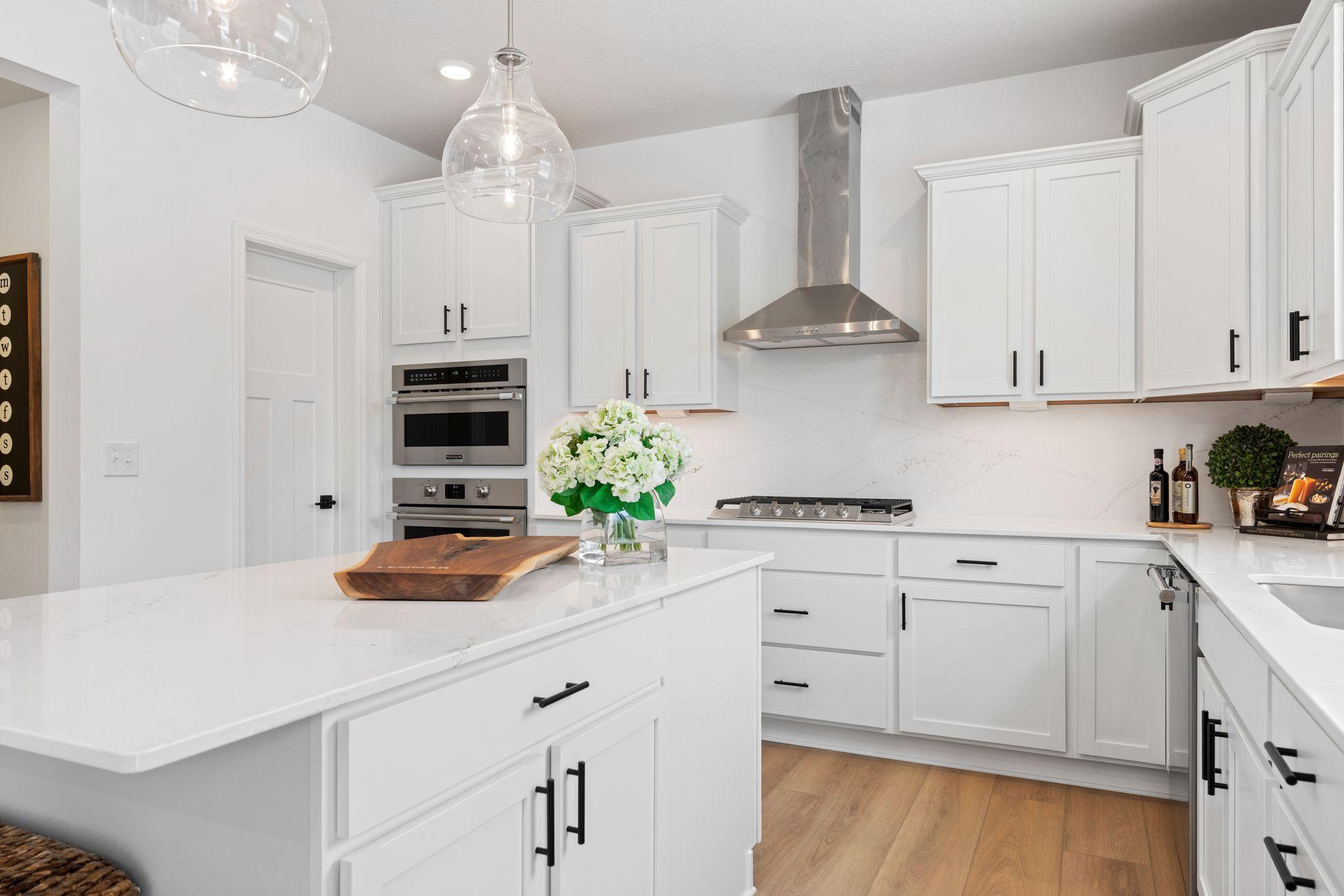 The kitchen has ease-of-access to the mudroom and flows seamlessly into the dining room