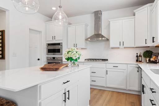 The kitchen has ease-of-access to the mudroom and flows seamlessly into the dining room