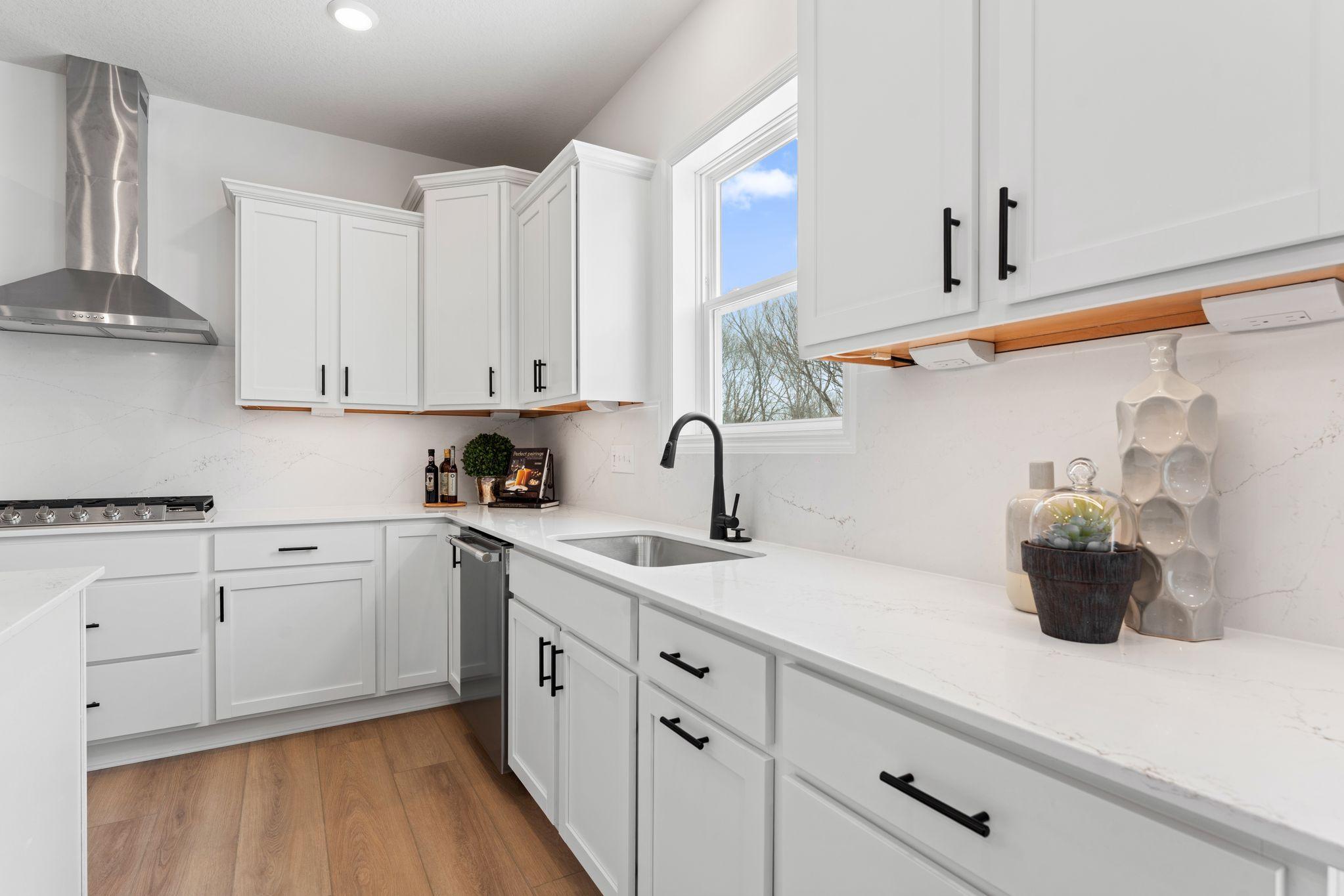 Shaker-style cabinetry provides plenty of storage for the aspiring chef