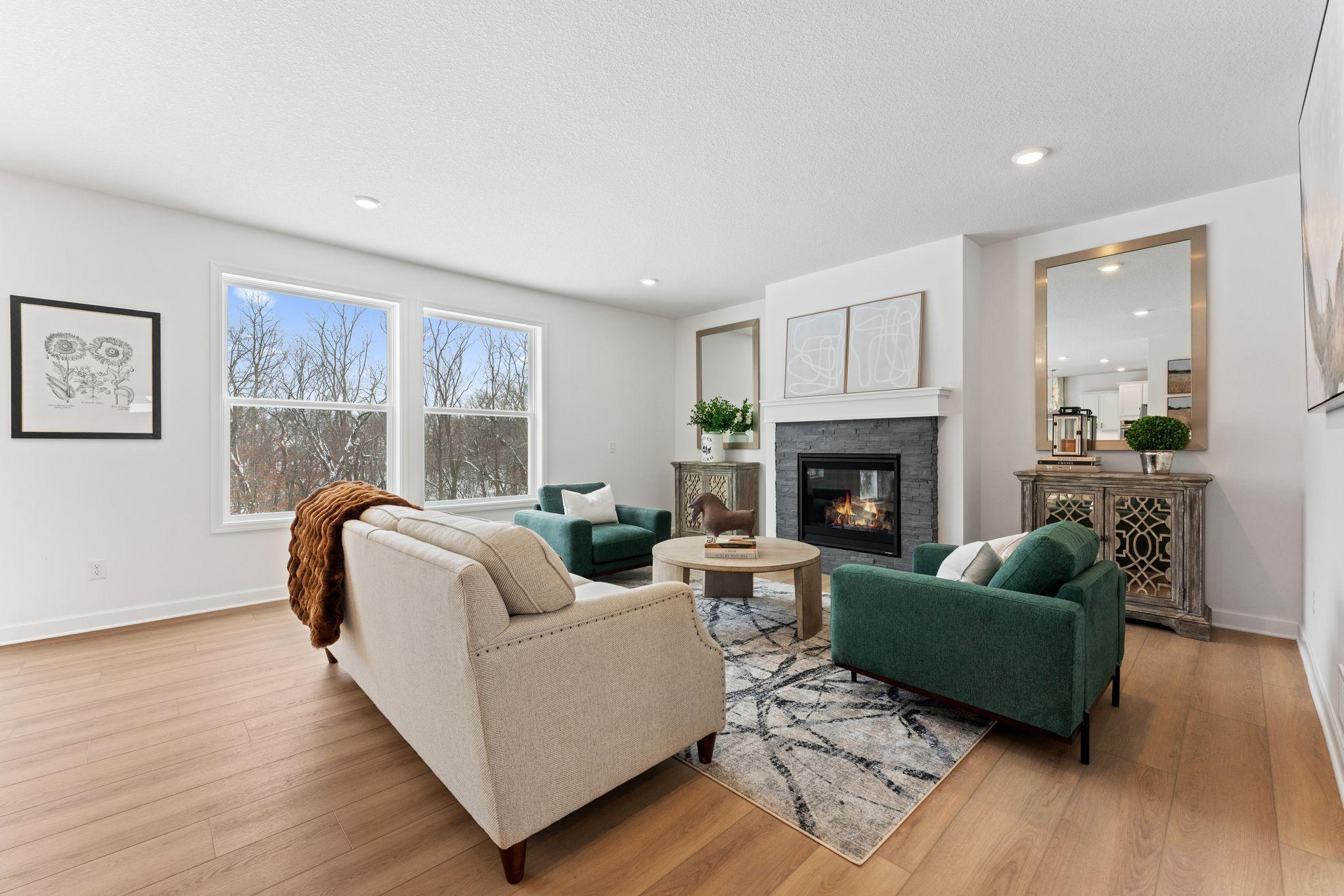 The Great Room features large windows for ample natural light and is the perfect place for gathering with friends and family.