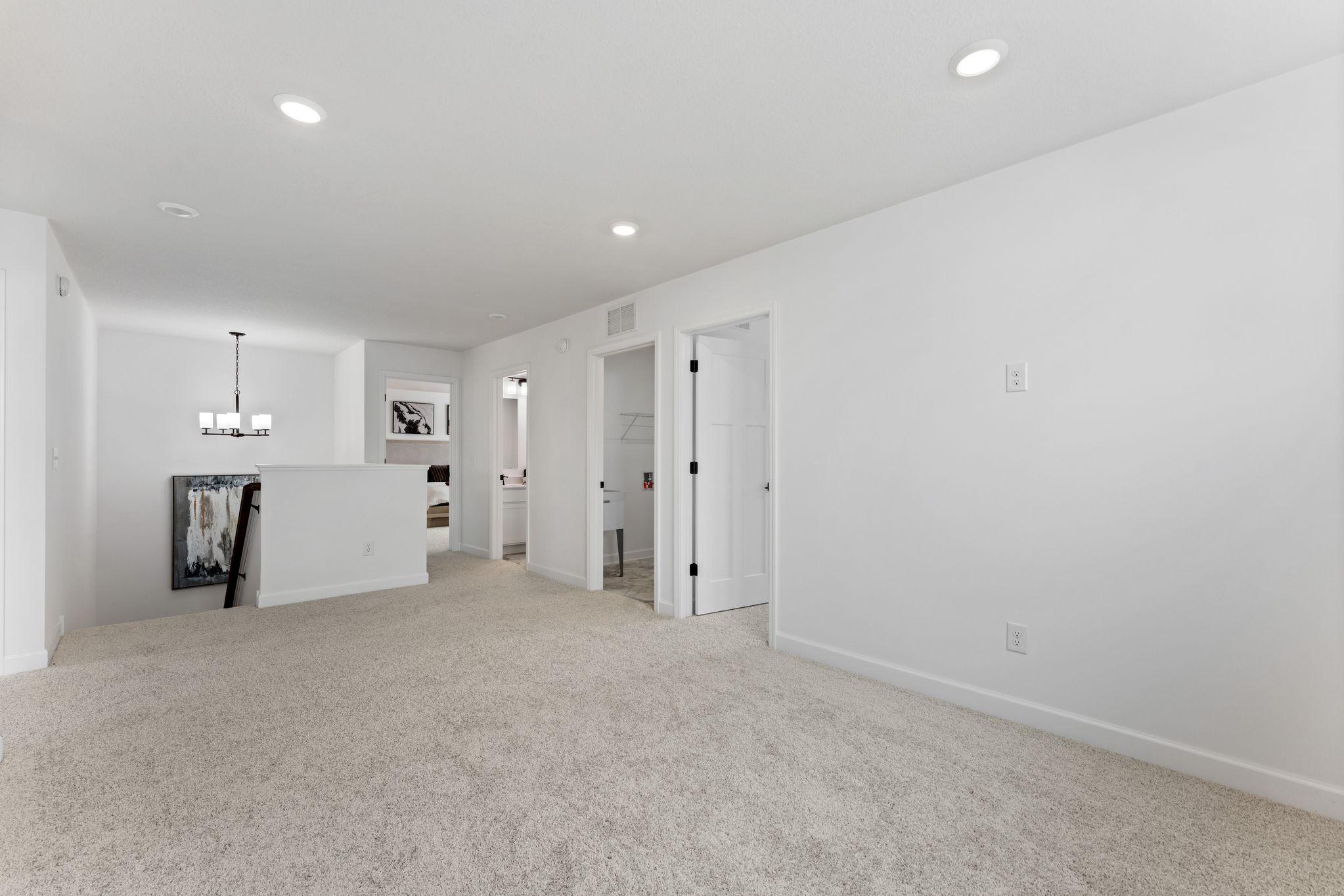 The loft area is located at the top of the stairs on the second floor and is well-suited for a living room or children’s area.