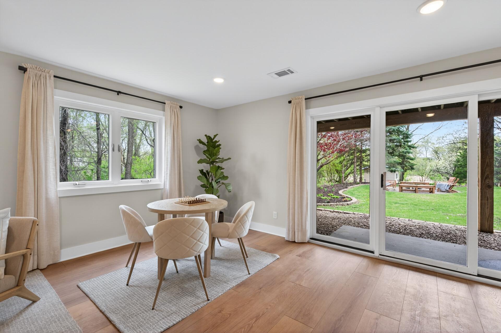 Large windows and a walkout backyard access bring natural light into the lower level creating a comfortable extension of the home's living and entertaining spaces.