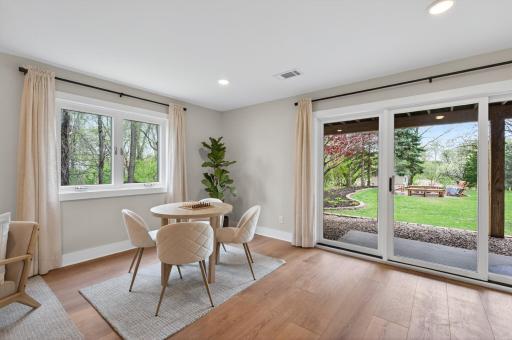 Large windows and a walkout backyard access bring natural light into the lower level creating a comfortable extension of the home's living and entertaining spaces.