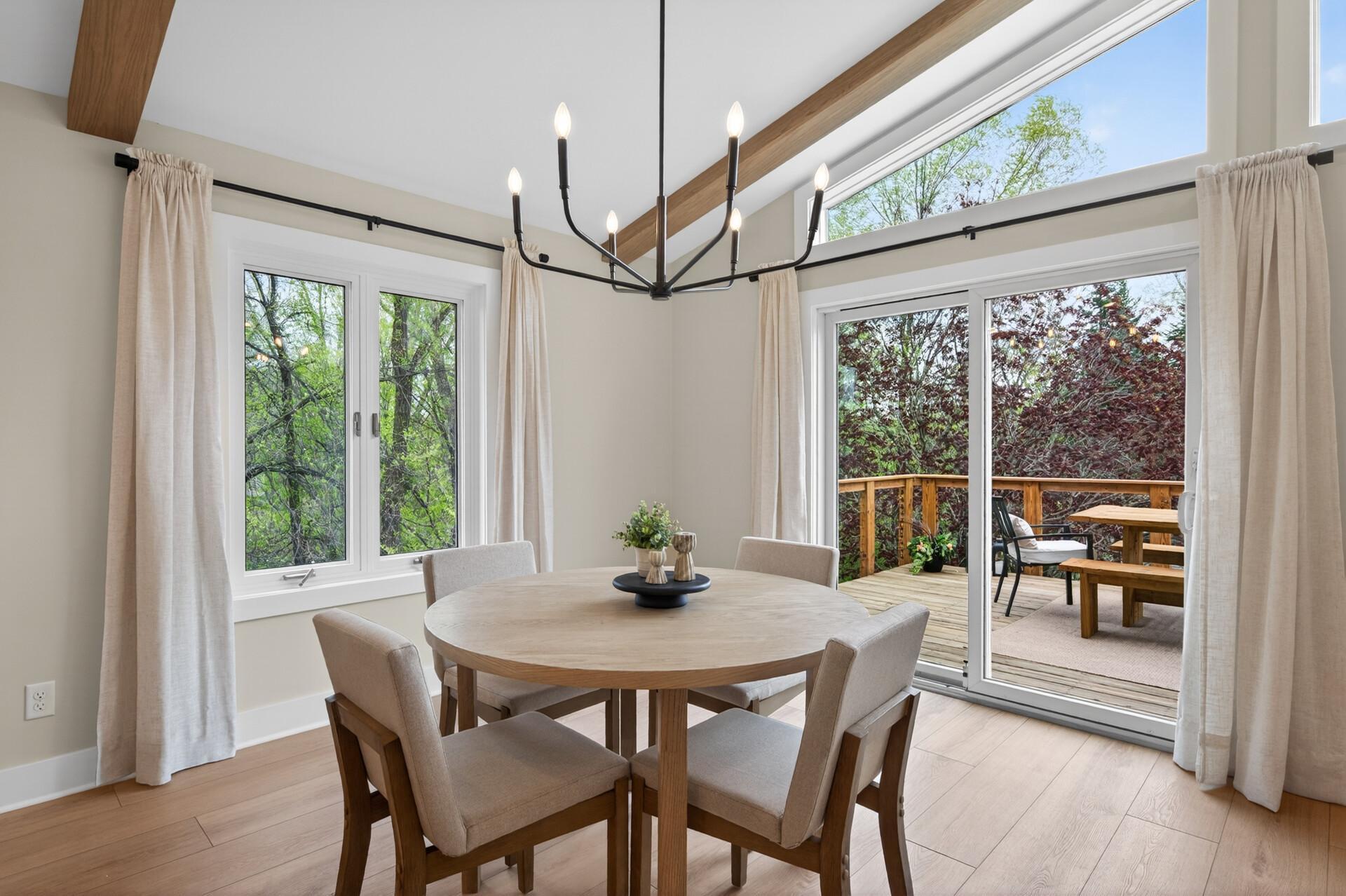 Step directly from the dining area onto the upper deck, creating seamless outdoor living.
