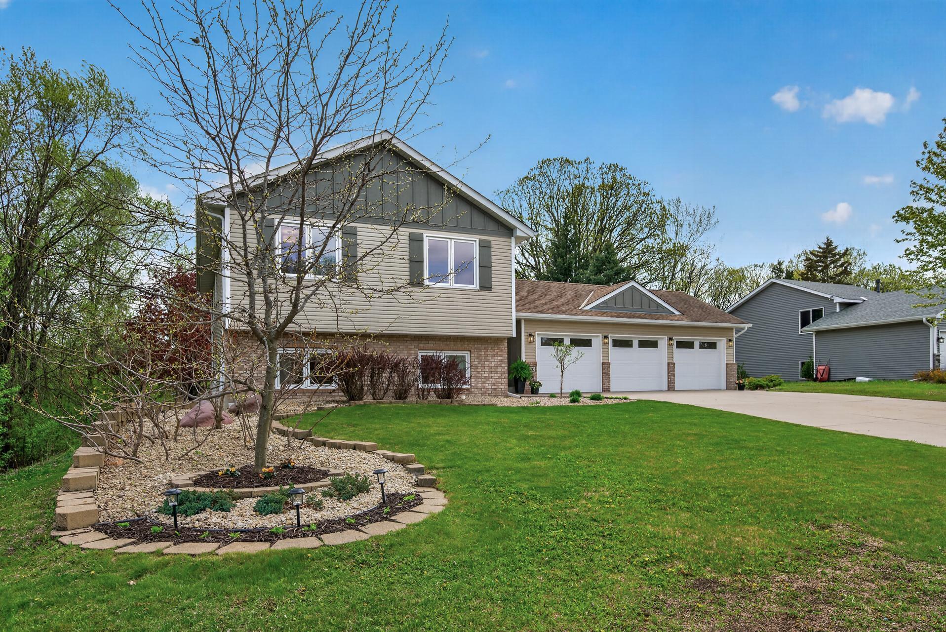 Beautifully updated exterior with manicured landscaping, oversized driveway and impressive curb appeal.
