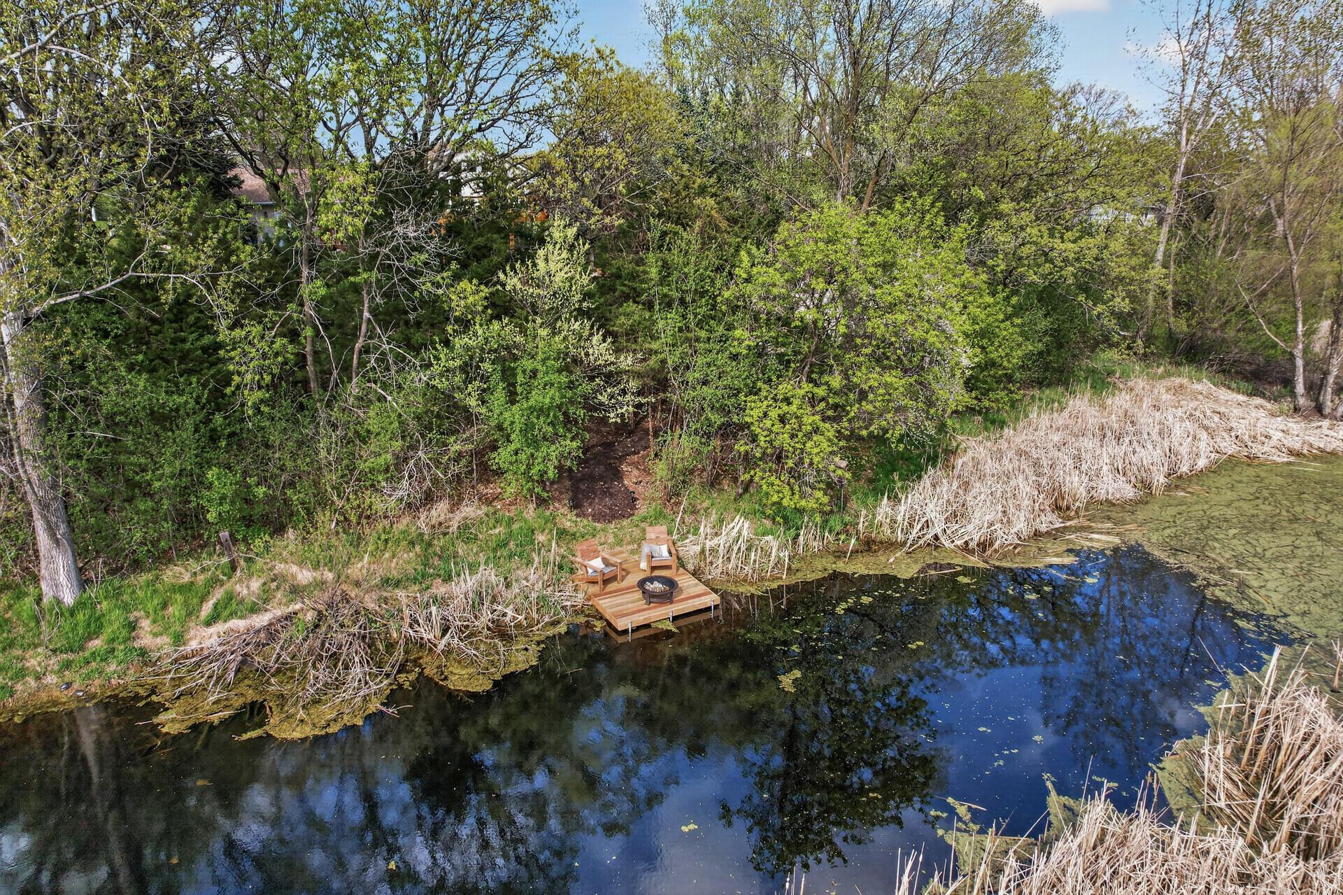 A private dock overlooking the water creates a truly unforgettable setting, offering a serene place to gather, unwind, and enjoy nature year-round.