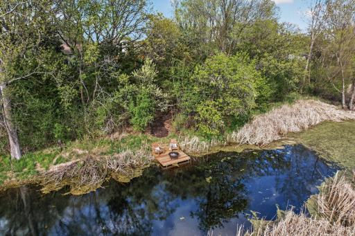 A private dock overlooking the water creates a truly unforgettable setting, offering a serene place to gather, unwind, and enjoy nature year-round.