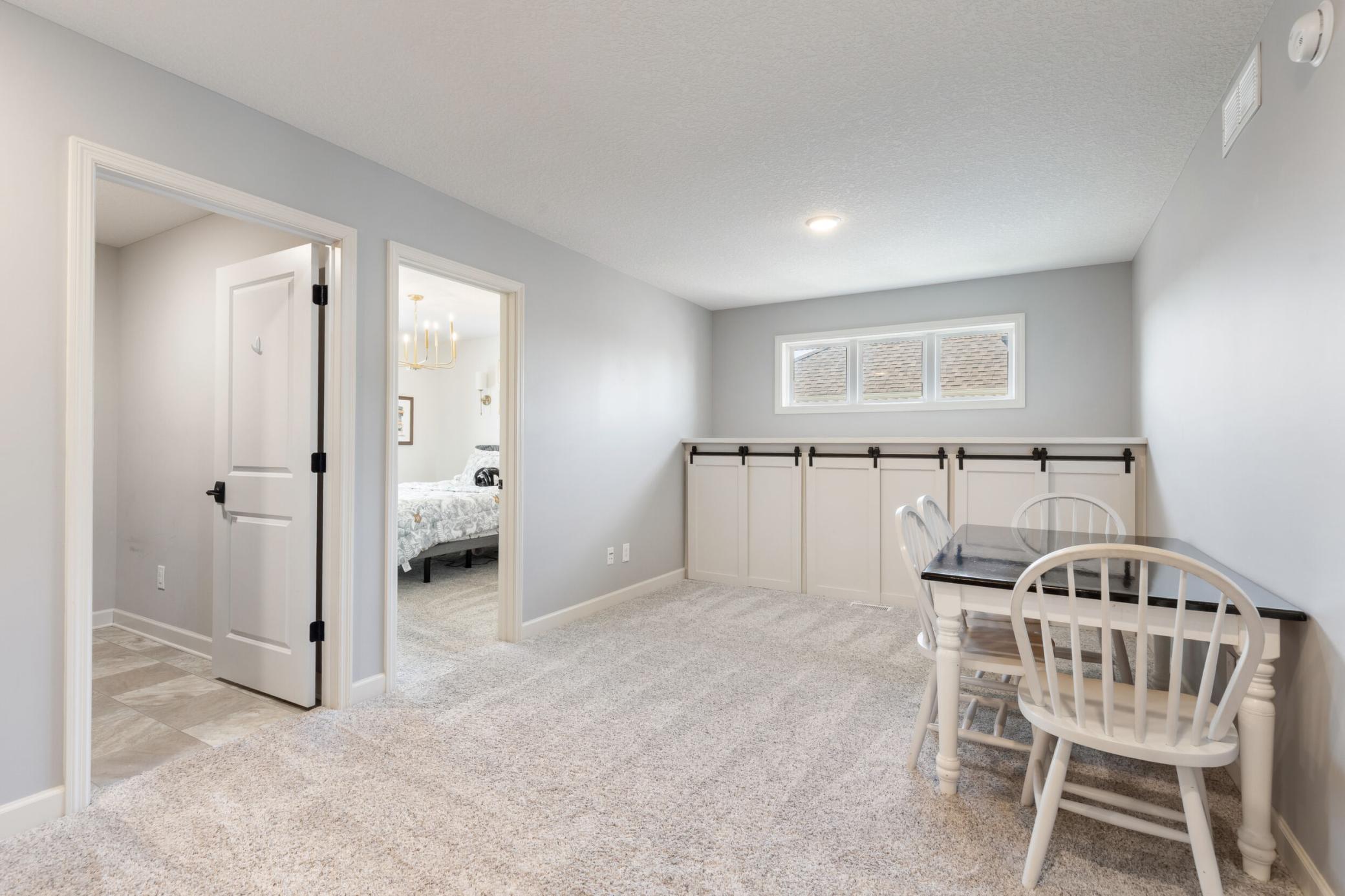The loft has lots of natural light and custom built in cabinets for storage