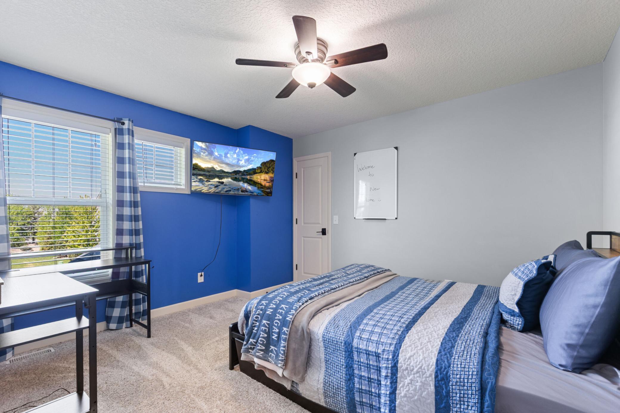 Another upper level bedroom, again with awesome windows and ceiling fan.