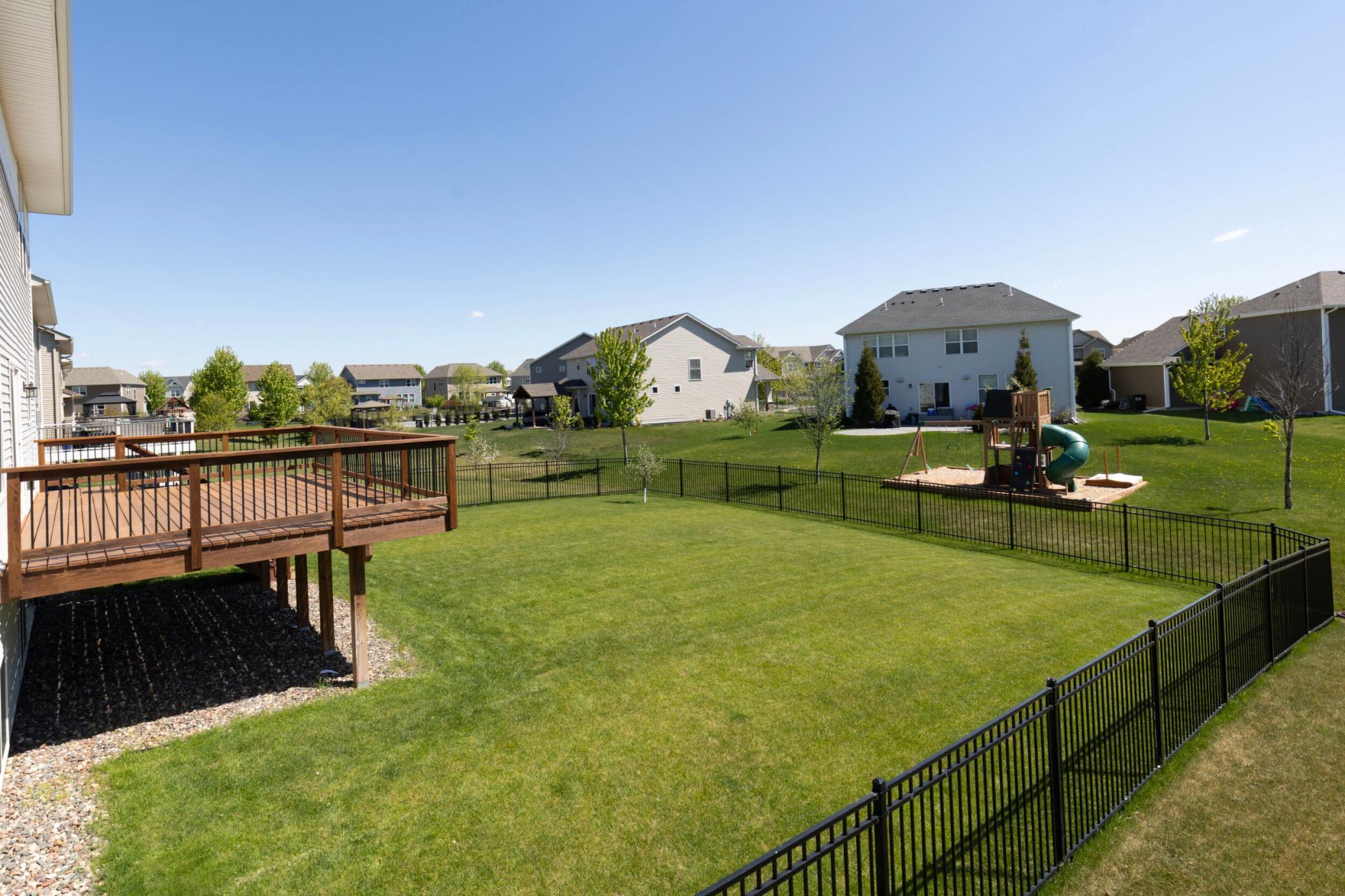 Look at this amazing deck that has a staircase down to the fabulous yard.