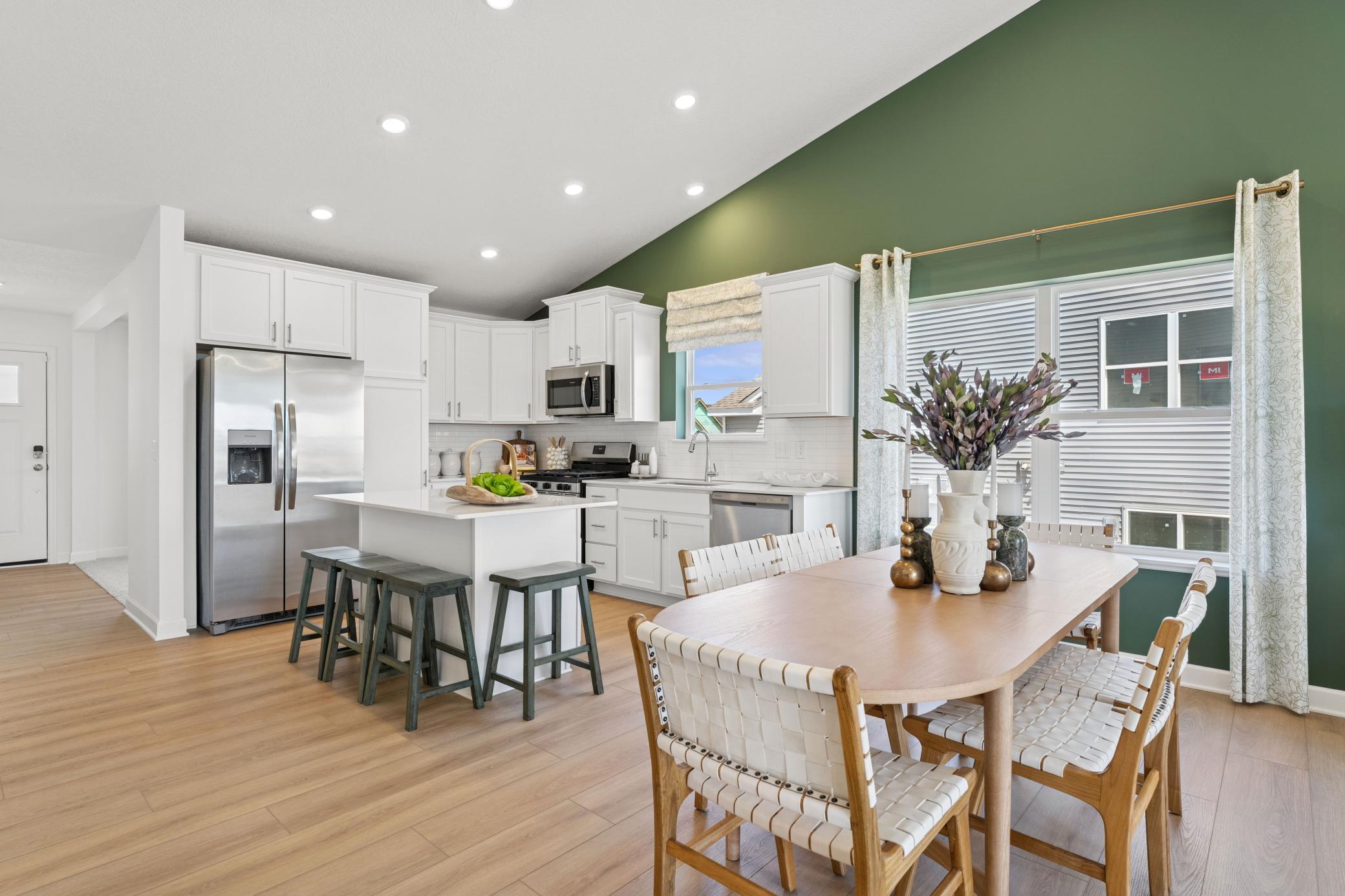 The dining area sits between the kitchen and Great Room and is ready for everything from family meals to game nights.