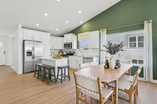 The dining area sits between the kitchen and Great Room and is ready for everything from family meals to game nights.