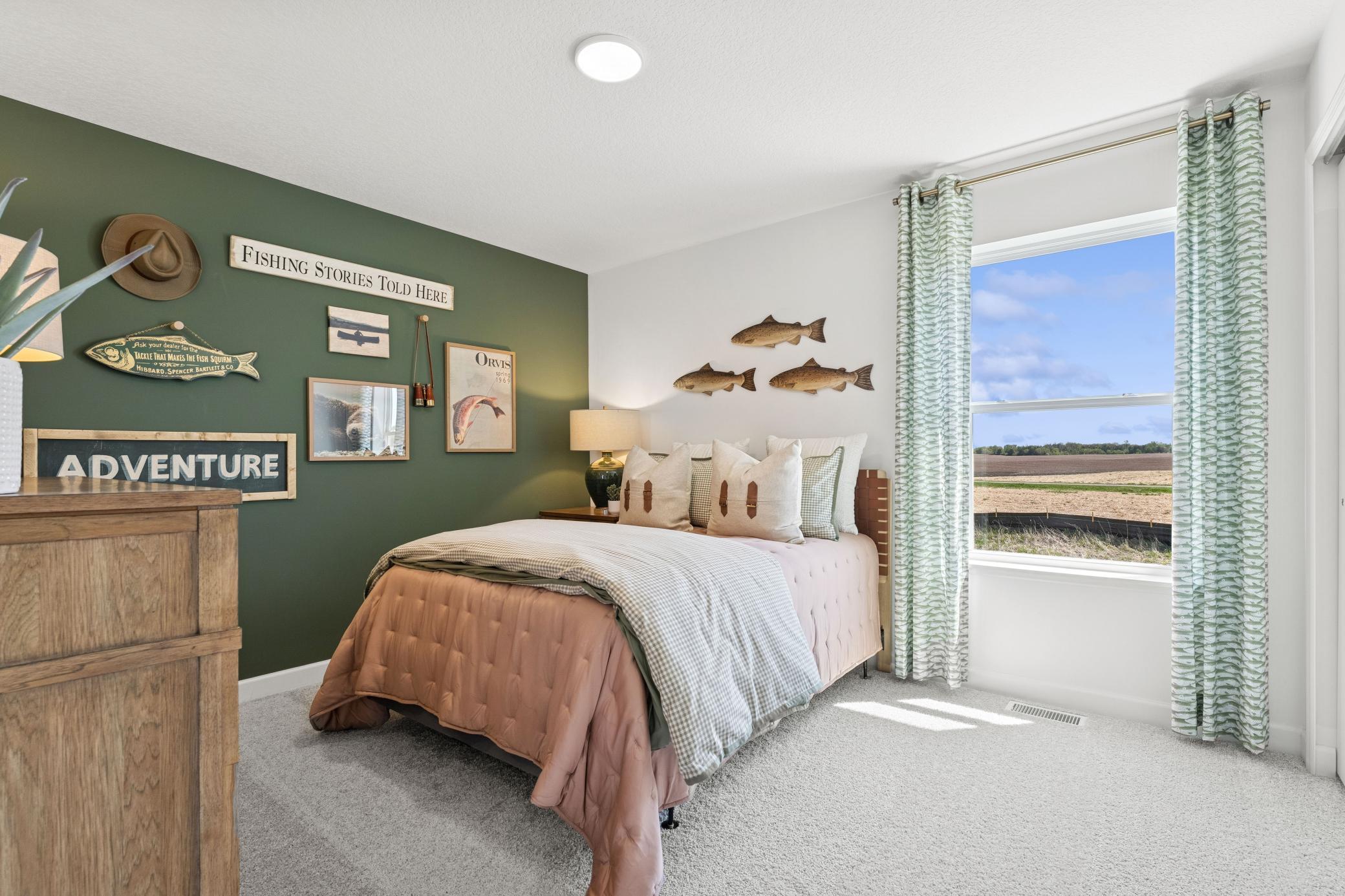 Two secondary bedrooms are located in a rear corner of the home, providing peaceful havens.