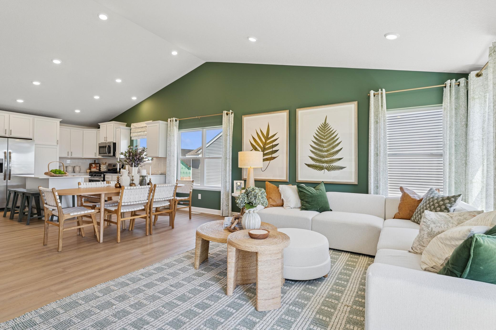 Airy and inviting, the Great Room is ideal for watching movies with the family and hosting special celebrations with guests. Open the adjacent glass-sliders to invite a refreshing breeze throughout the home.