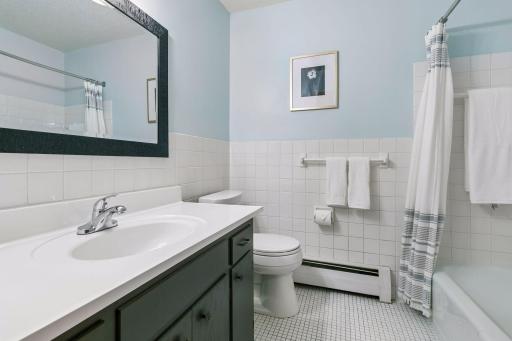 Updated, full hall bath with comfort height commode.