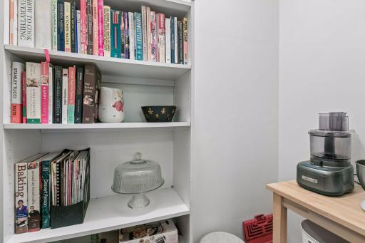 Walk-in pantry. Great for storing larger appliances and your favorite cookbooks. An electric outlet in the pantry space.