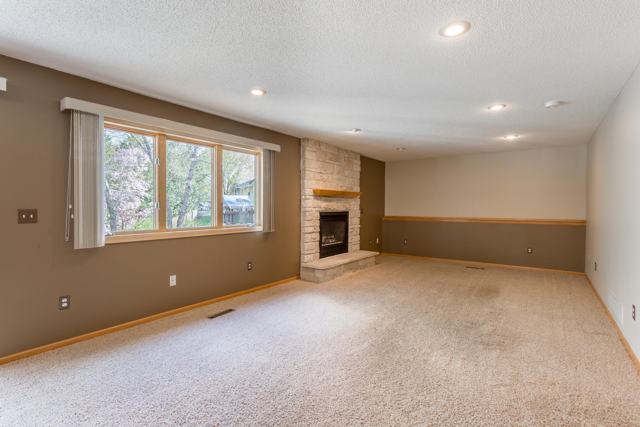 Basement family room with gas fireplace