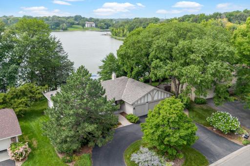 Mitchell Lake Setting with Mature Trees and Half Circle Driveway