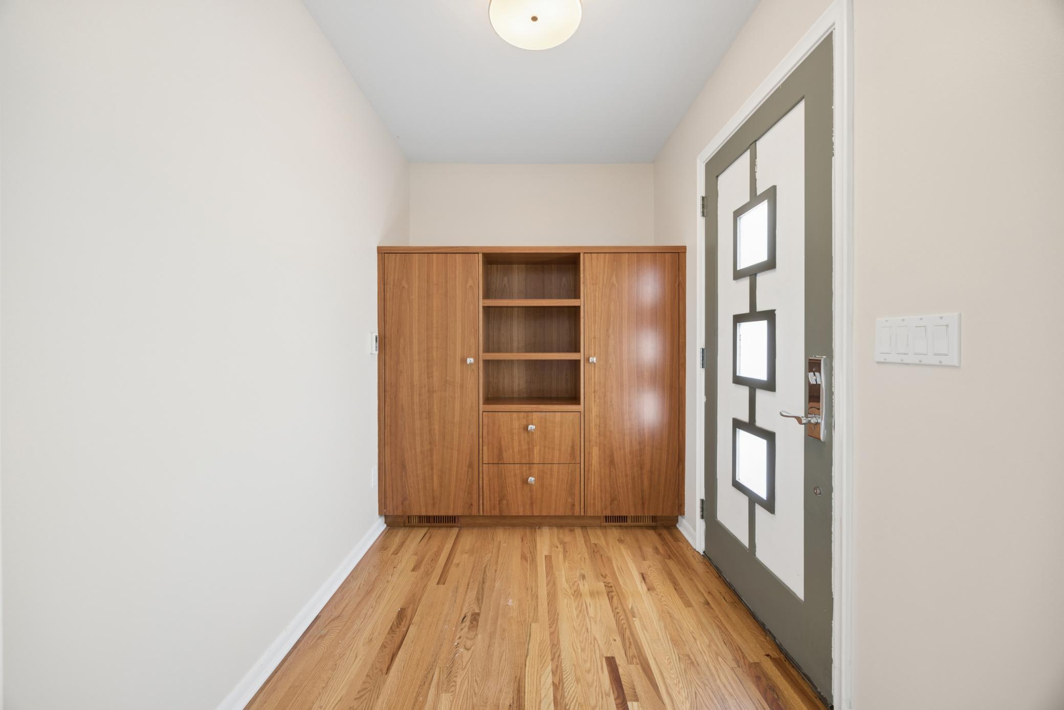 View of front foyer with custom built-ins