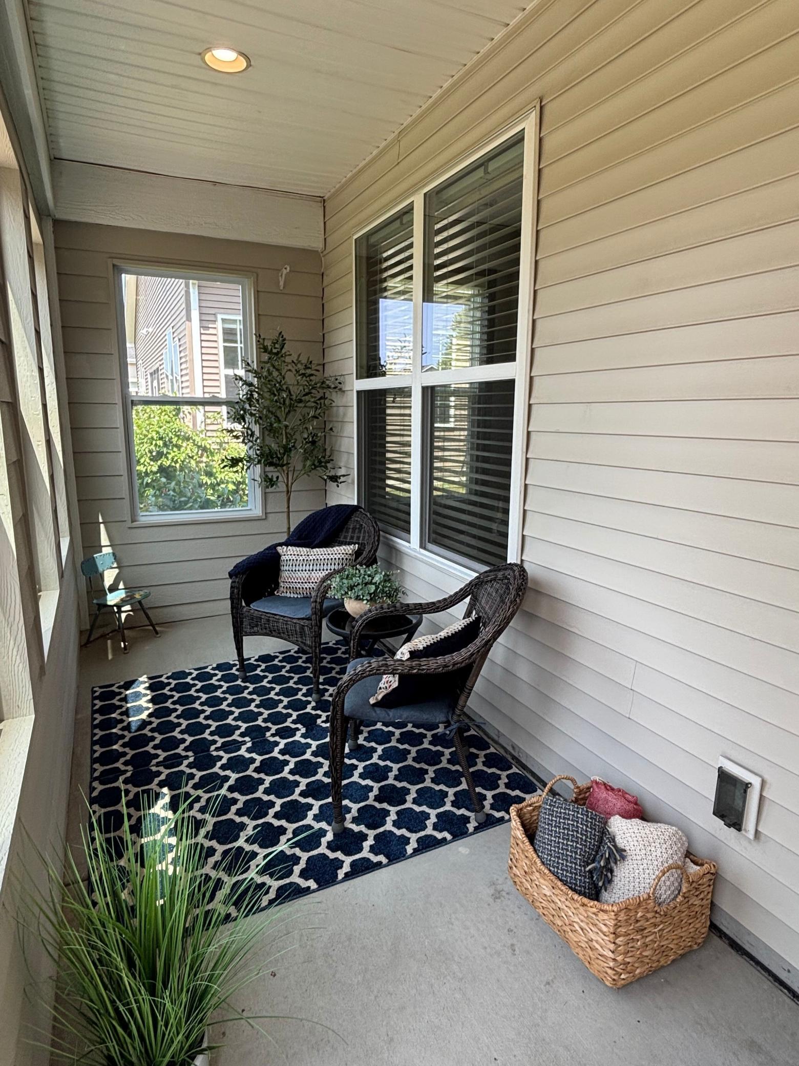 Cozy and bright 3-season porch with brand new windows overlooking the scenic backyard.