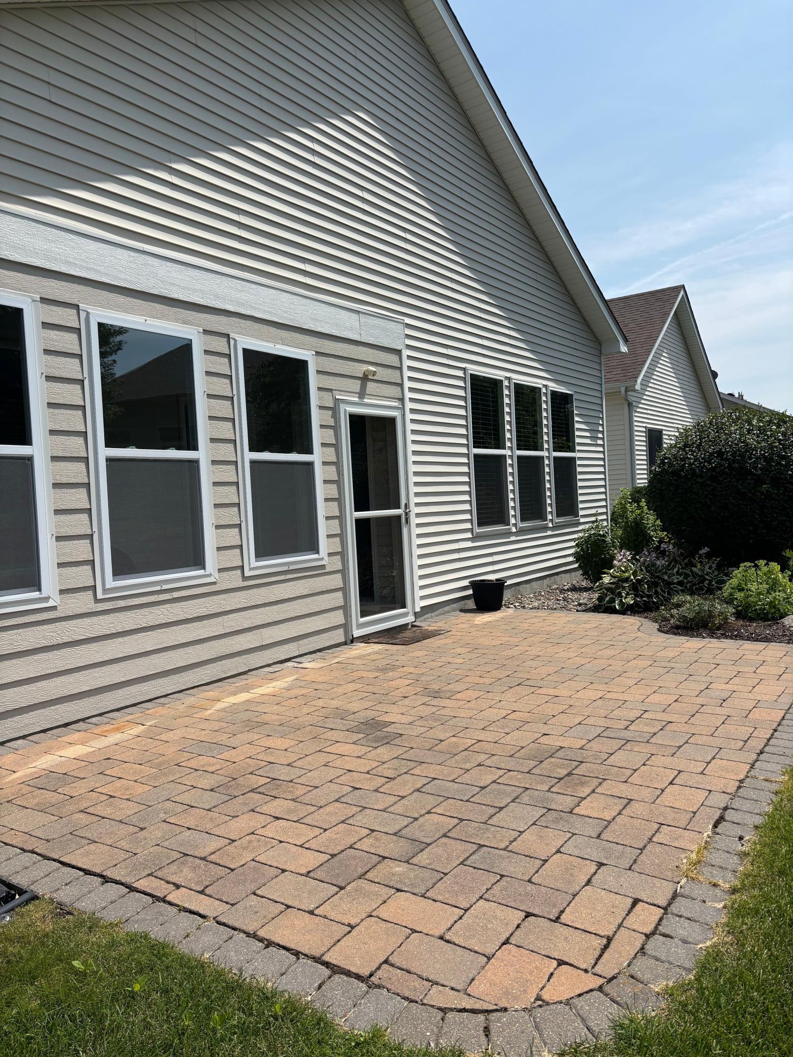 Large patio with room for plenty of furniture and grilling