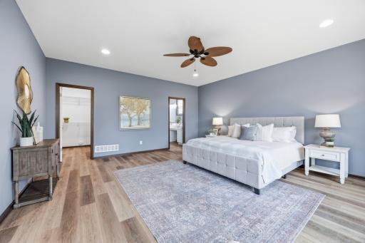 Primary bedroom is generously size with room for plenty of furniture, private access to the 3 season porch, and a large walk-in closet.
