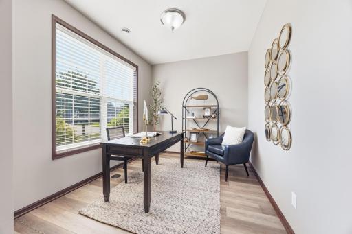 Front office with abundant natural light, offering a dedicated and comfortable work-from-home space.