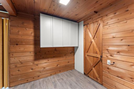Throughout the lower level you will find the original 1950's knotty pine tounge & groove paneling on the walls & ceiling, as well as doors.