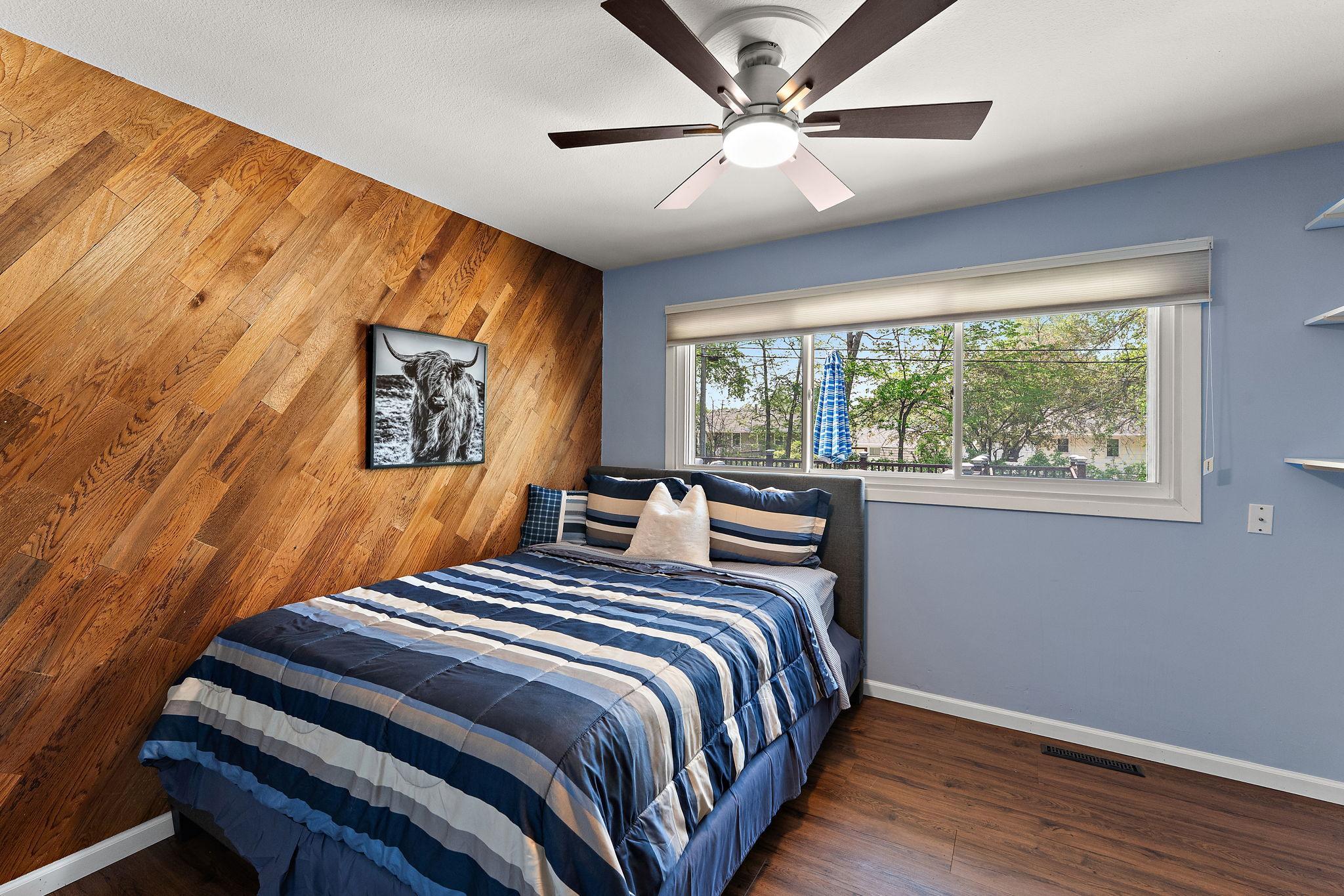 The first of 3 bedrooms on the main level, overlookng the back yard.