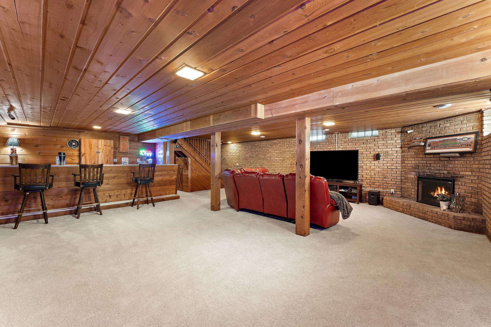 Room for a pool table? Yes! Ping Pong Table? Yes! Kids play world? For sure! The fireplace has an electric insert that actually warms the room!