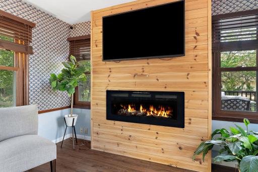 You will find a custom fireplace/TV wall.