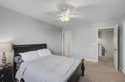 Upper level primary bedroom with private bathroom.