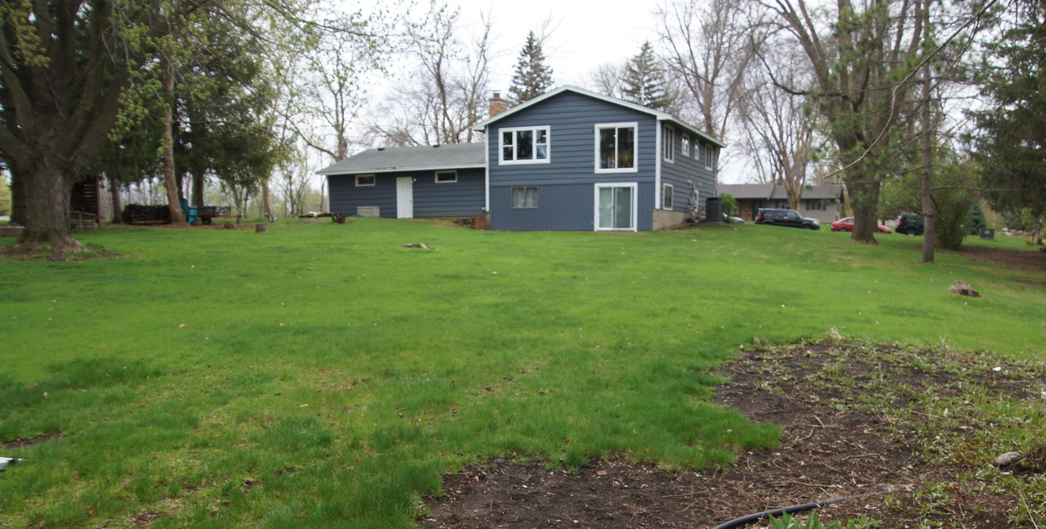 Large backyard offering ample space for outdoor activities and entertainment. Perfect for yard games, and with the potential for fantastic additions such as Pool? ,Fire Pit, Outdoor Kitchen, Playground equipment or Swing set!