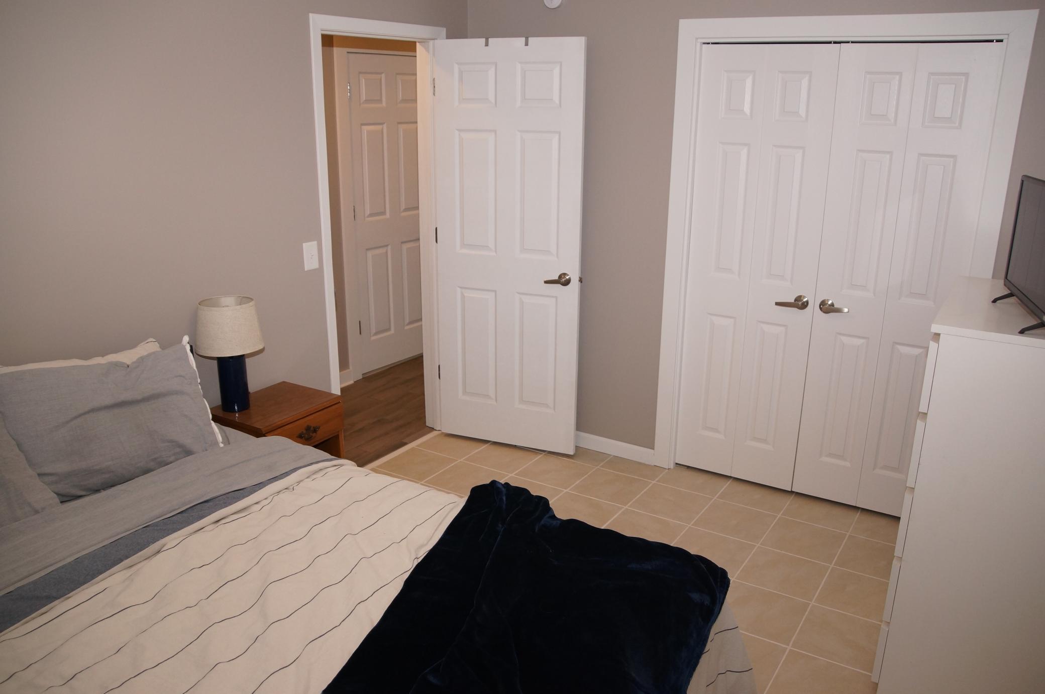 3rd Bedroom is in the Lower Level, sports Newer window, Tile floors. There is a Similar Fourth Bedroom across the hall currently being used for storage for the move. (no picture)
