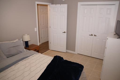 3rd Bedroom is in the Lower Level, sports Newer window, Tile floors. There is a Similar Fourth Bedroom across the hall currently being used for storage for the move. (no picture)