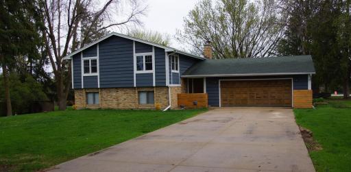 Nicely updated Split Foyer Home on a large level 3/4 Acre lot! Home feature Wood Siding with Brick Wainscot Accent, Covered Entry, Concrete Driveway and Oversized Insulated & Heated Garage!
