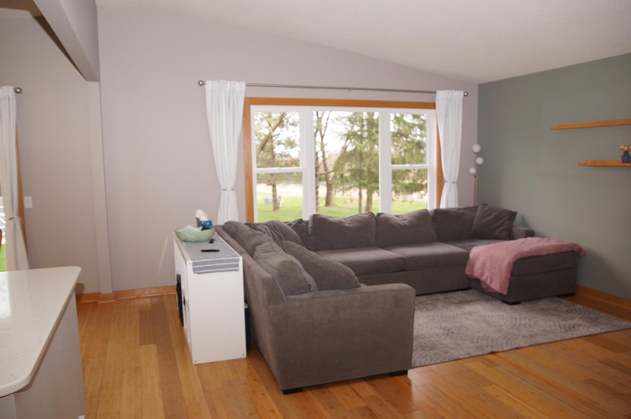 Spacious Living Room sports Newer Windows, Bamboo Floors and Vaulted Ceilings!