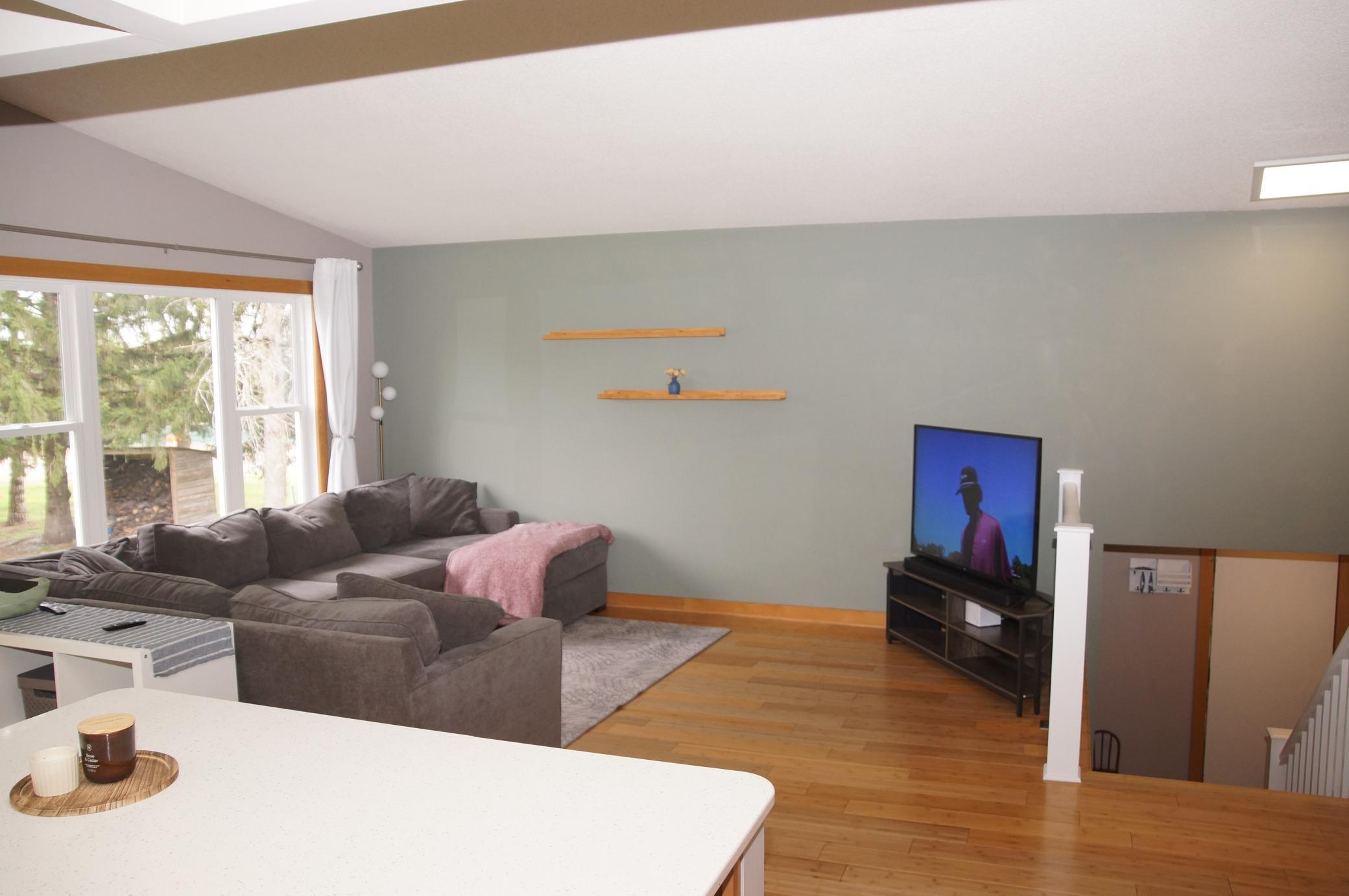 Center Island from Kitchen to Spacious Living Room for an open concept feeling! Newer Windows, Bamboo Floors and Vaulted Ceilings complete the ambiance!