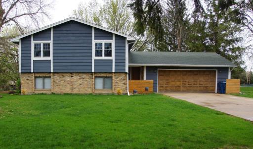 Nicely updated Split Foyer Home on a large level 3/4 Acre lot! Home feature Wood Siding with Brick Wainscot Accent, Covered Entry, Concrete Driveway and Oversized Insulated & Heated Garage!
Concrete Driveway