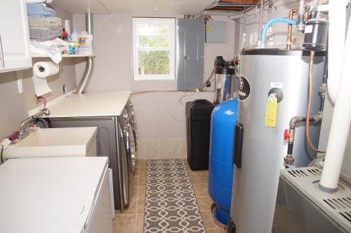 Laundry with Folding table Plus High-end Washer and Dryer Stay!