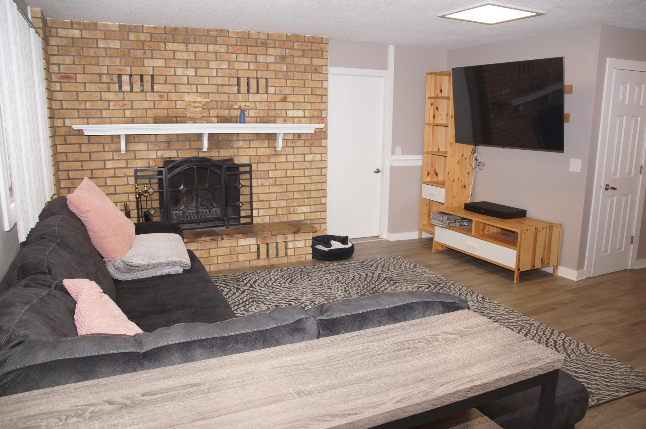 Amusement Room has a Brick Fireplace with built-in Heatolater! Sit around and enjoy the warmth of the fire!
Plus there is a 2nd access door to garage!