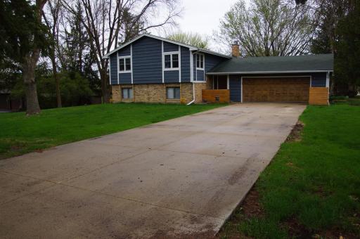 Nicely updated Split Foyer Home on a large level 3/4 Acre lot! Home feature Wood Siding with Brick Wainscot Accent, Covered Entry, Concrete Driveway and Oversized Insulated & Heated Garage!