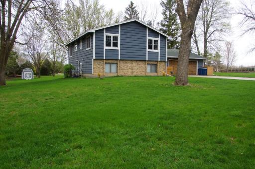 Nicely updated Split Foyer Home on a large level 3/4 Acre lot! Home feature Wood Siding with Brick Wainscot Accent, Covered Entry, Concrete Driveway and Oversized Insulated & Heated Garage!