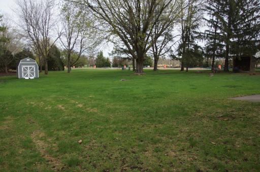 Large backyard offering ample space for outdoor activities and entertainment. Perfect for yard games, and with the potential for fantastic additions! There is also a Newer Shed for storing yard accessories!